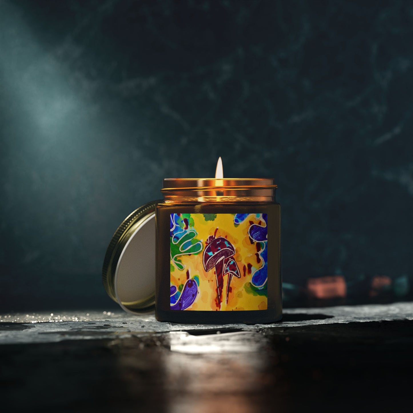 Candle with a colorful label on a dark background