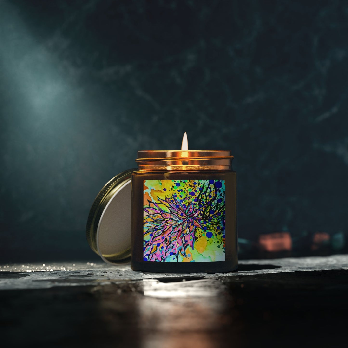 Candle in a decorative jar with a colorful label on a dark background