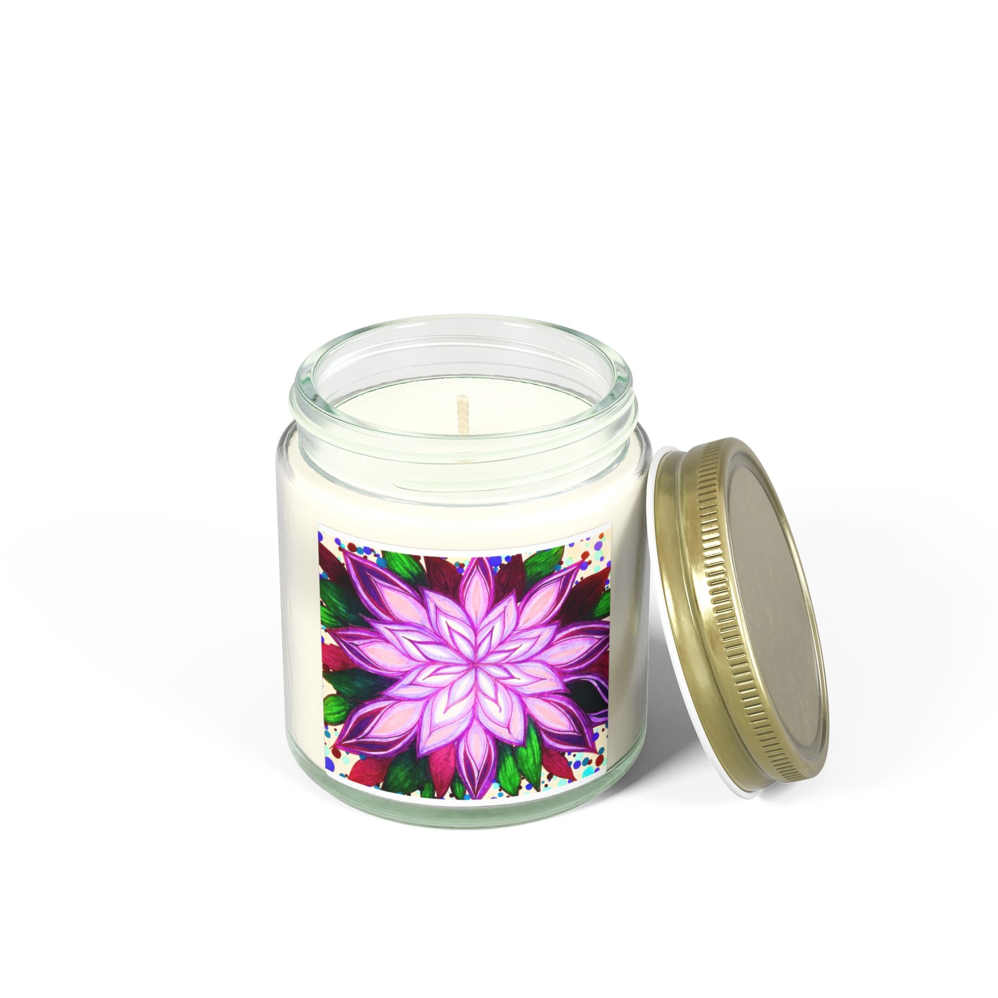 Candle in a glass jar with a colorful flower design on the label, on a white background