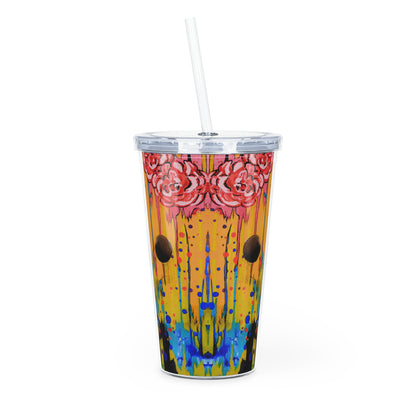 Colorful tumbler with floral design and straw on a white background