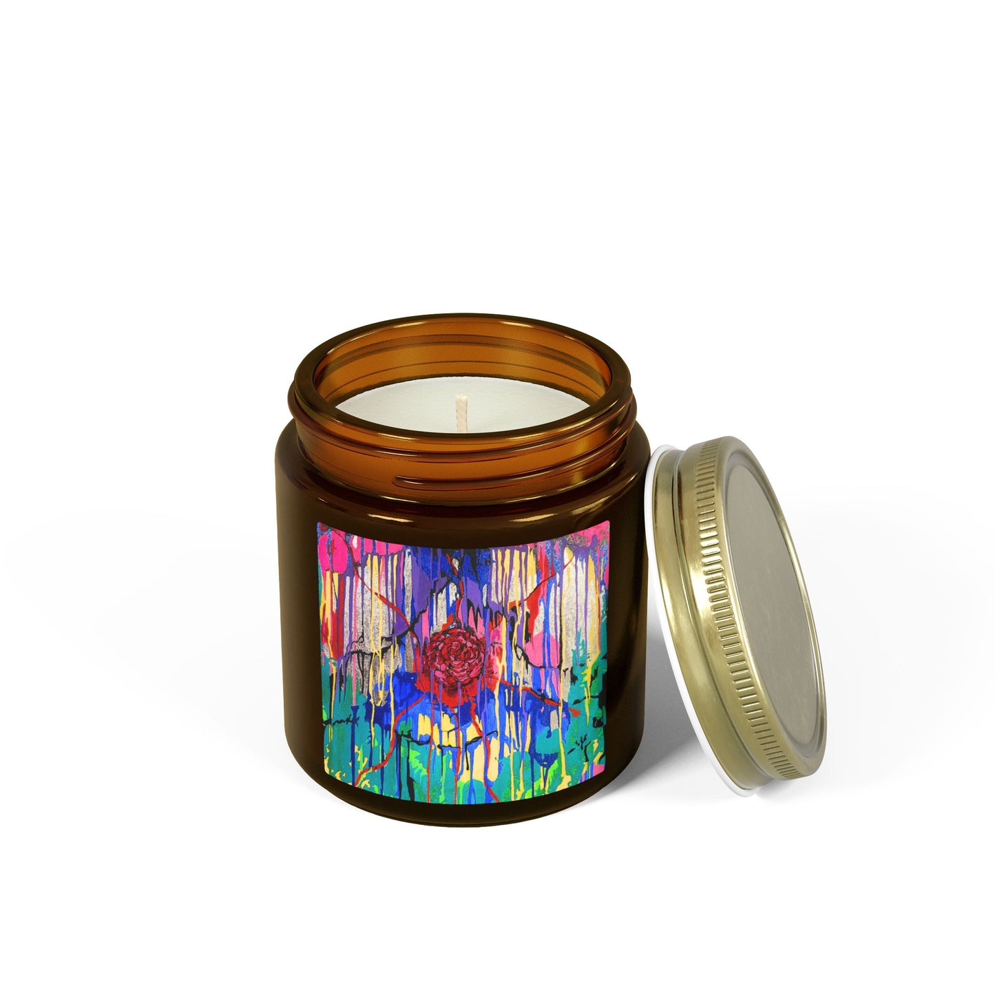 Candle jar with colorful label and gold lid on a white background