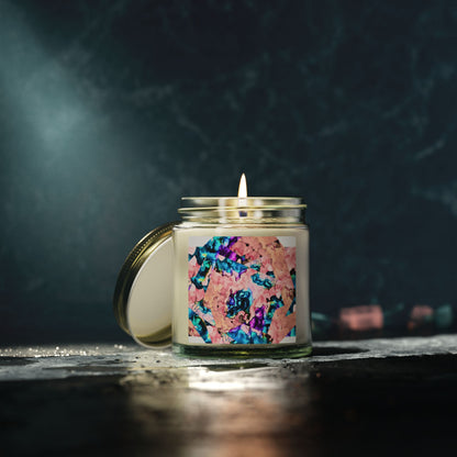 Candle in a glass jar with a colorful label on a dark background