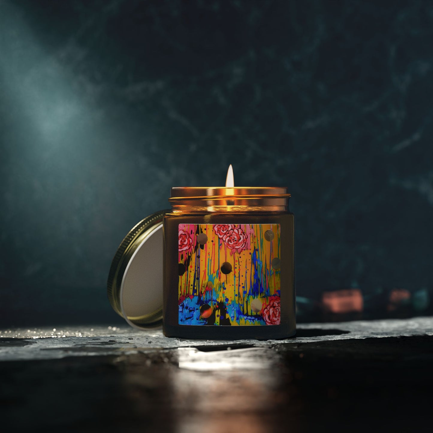 Candle in a colorful jar with a dark background