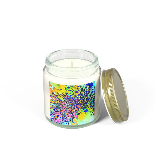 Candle in a glass jar with a colorful label and gold lid on a white background