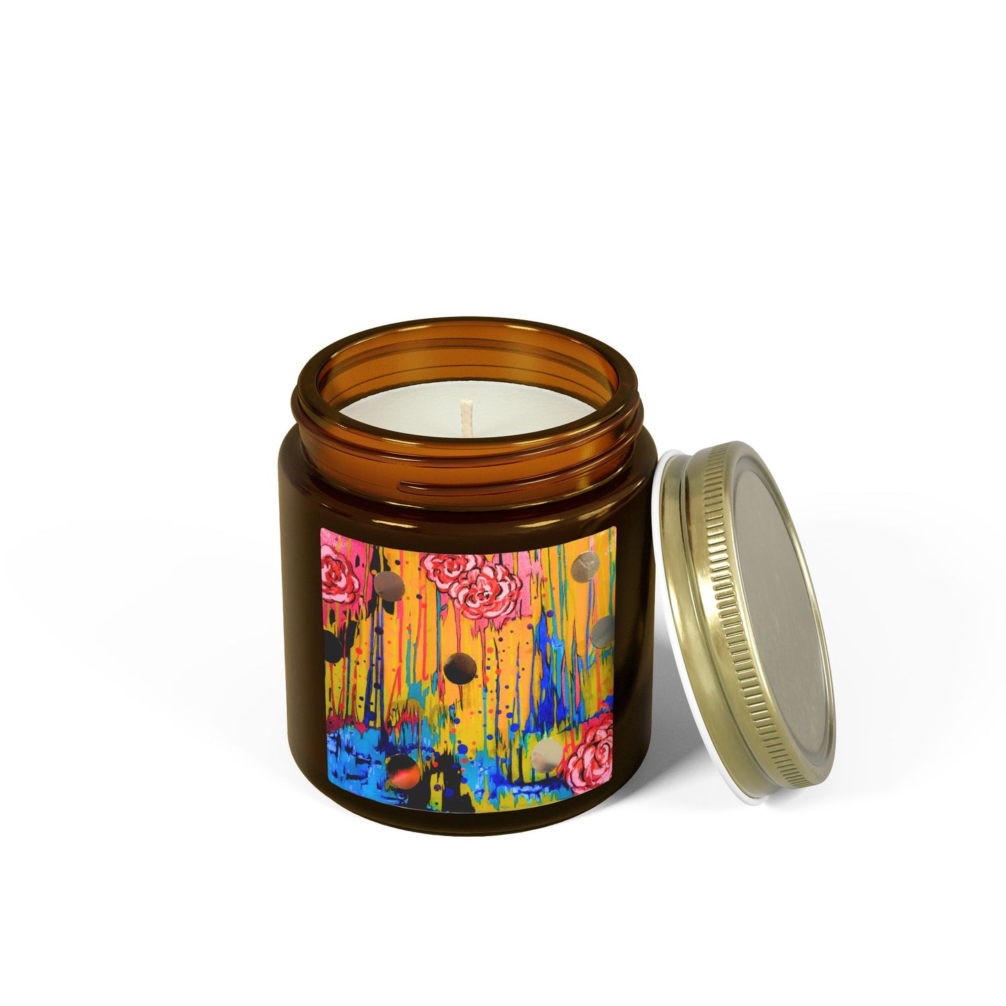 Candle in an amber jar with a colorful label on a white background