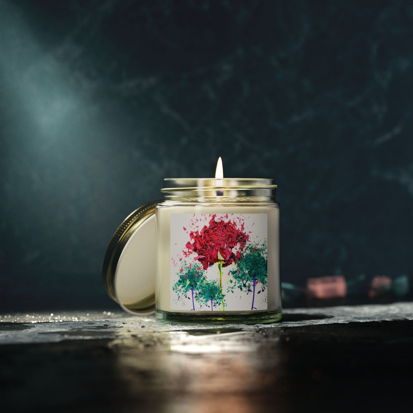 Candle in a glass jar with a floral label on a dark background