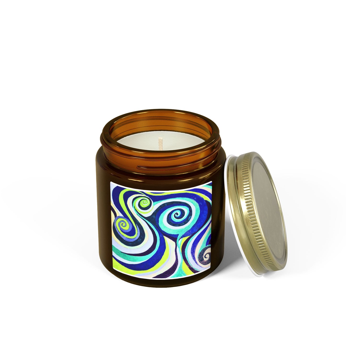 Candle in an amber jar with a colorful label and gold lid on a white background