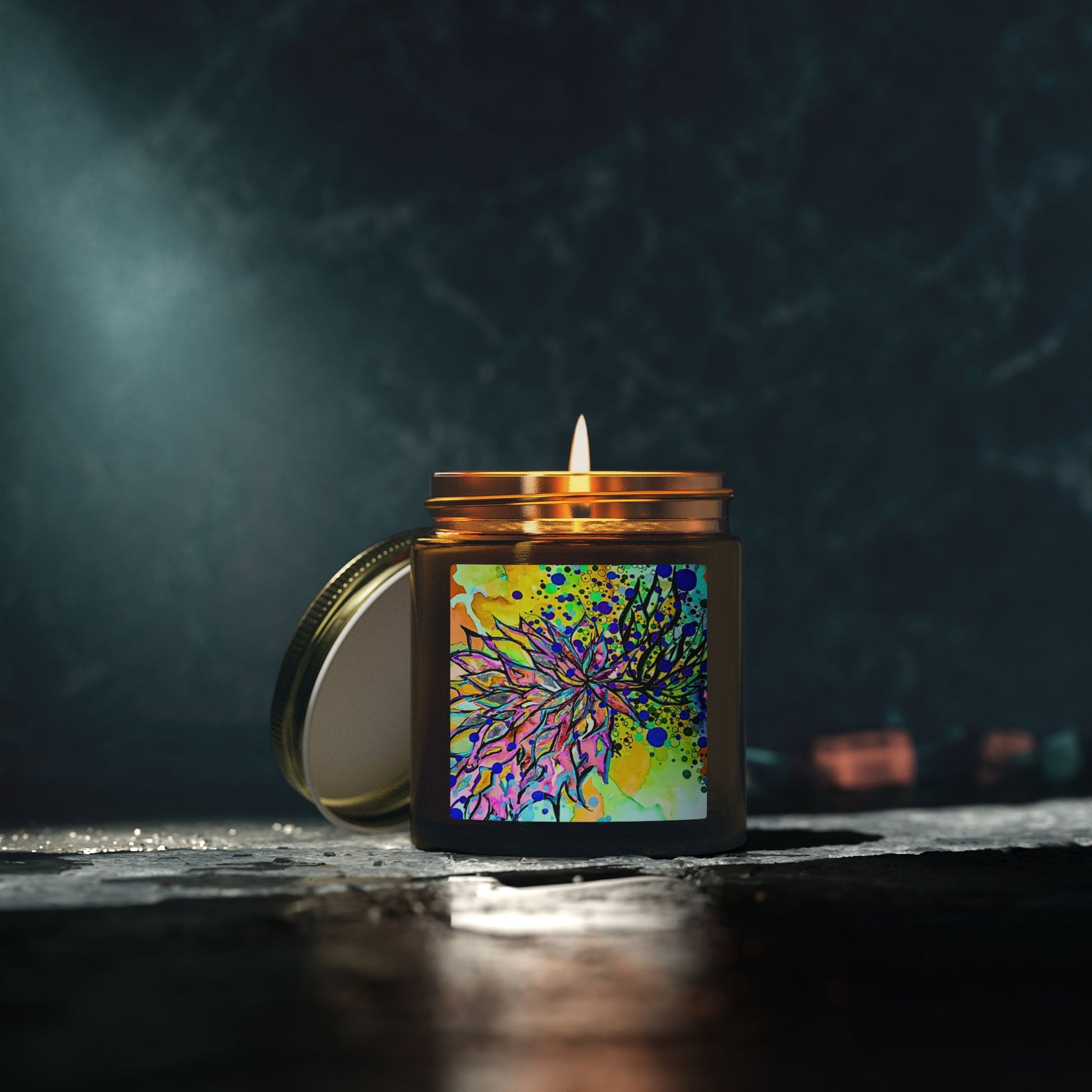 Candle in a decorative jar with a colorful label on a dark background