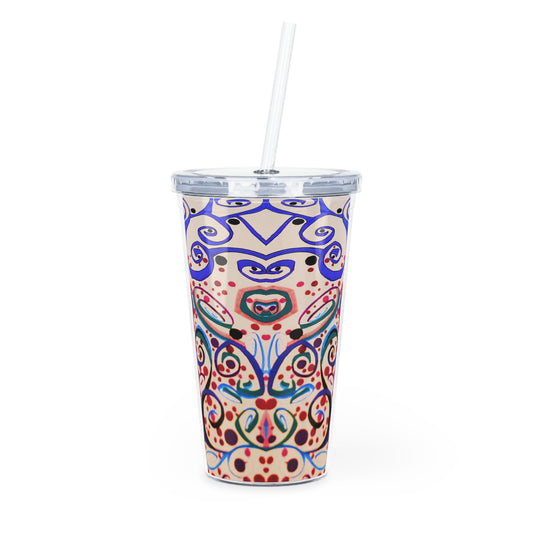 Colorful patterned tumbler with a straw on a white background