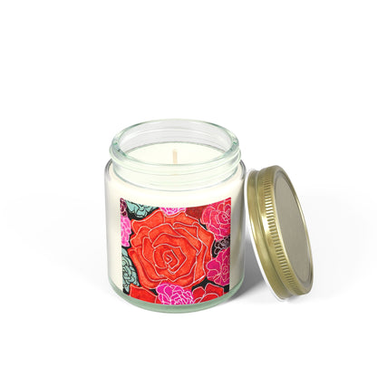 Candle in a glass jar with a colorful rose design on the label, on a white background