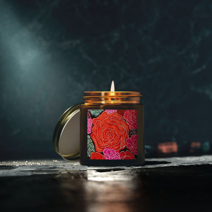 Candle in a decorative jar with a rose design on a dark background