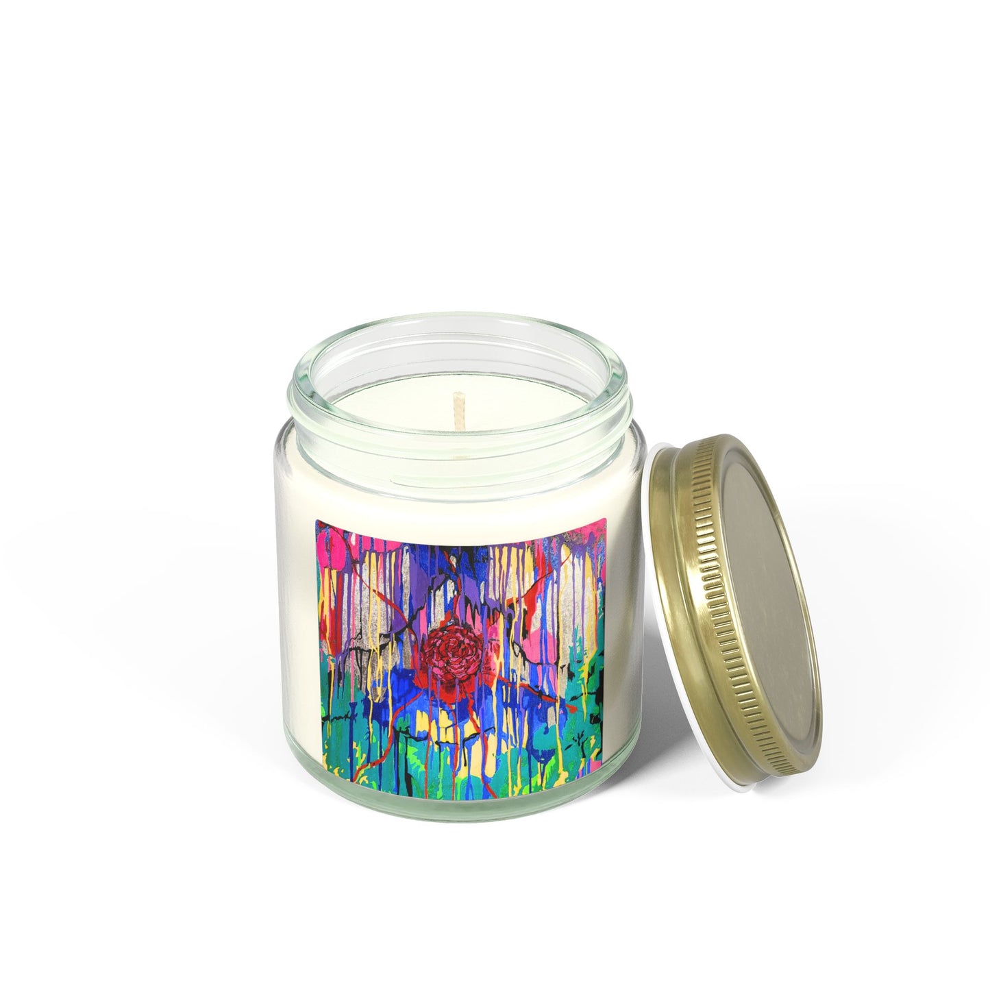 Candle in a glass jar with a colorful label and gold lid on a white background