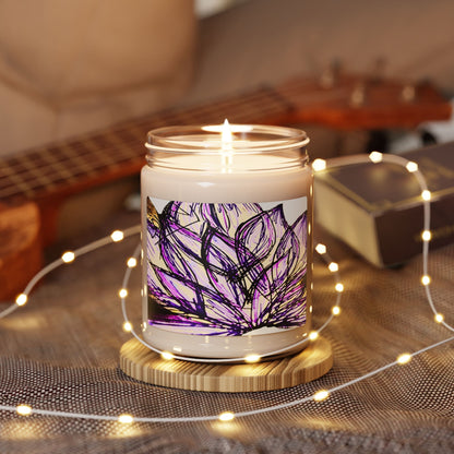 Candle with a purple lotus flower design on a wooden coaster surrounded by string lights and a guitar in the background.