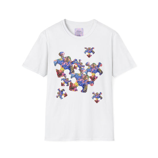 White t-shirt with colorful puzzle piece design on a white background